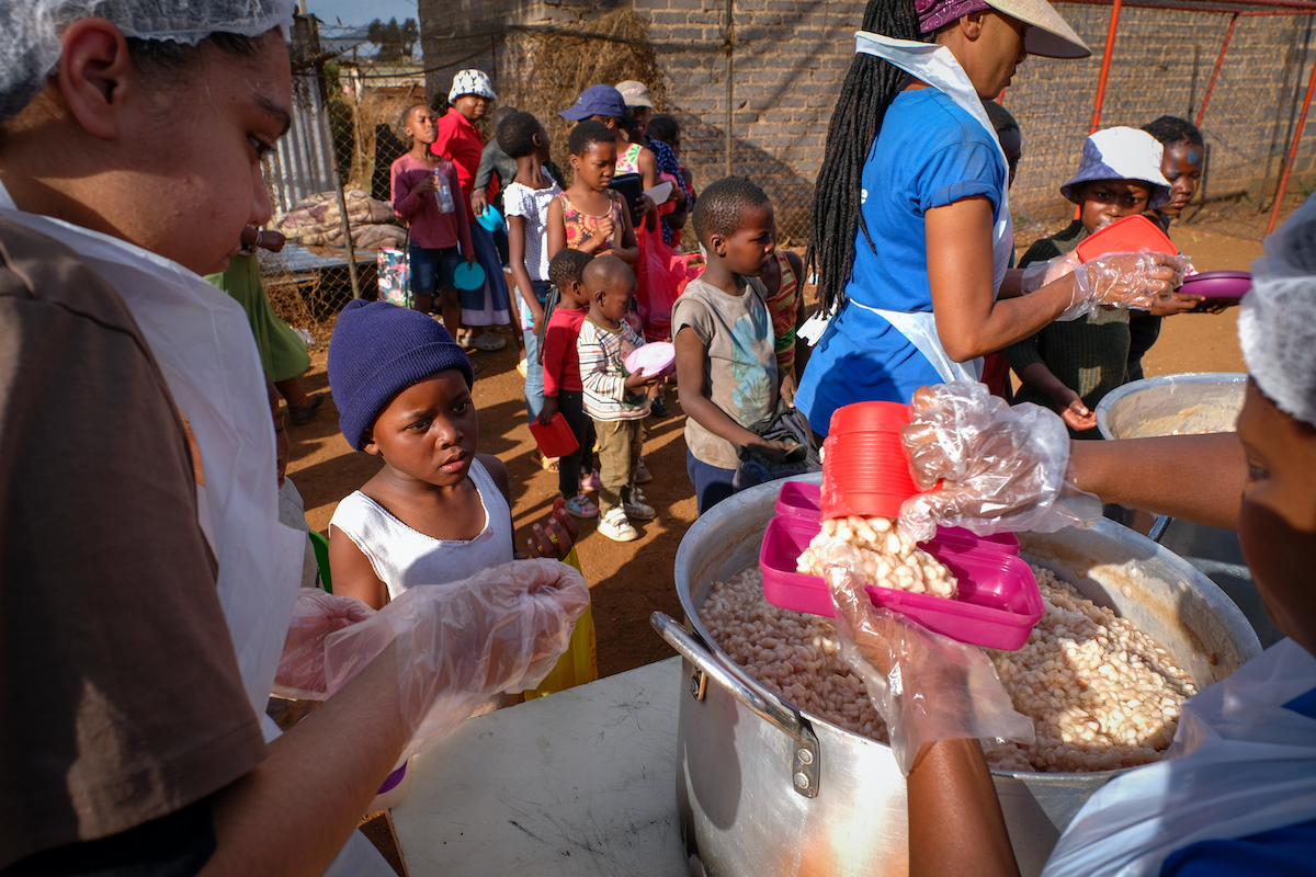 children eating at friday night feeding station