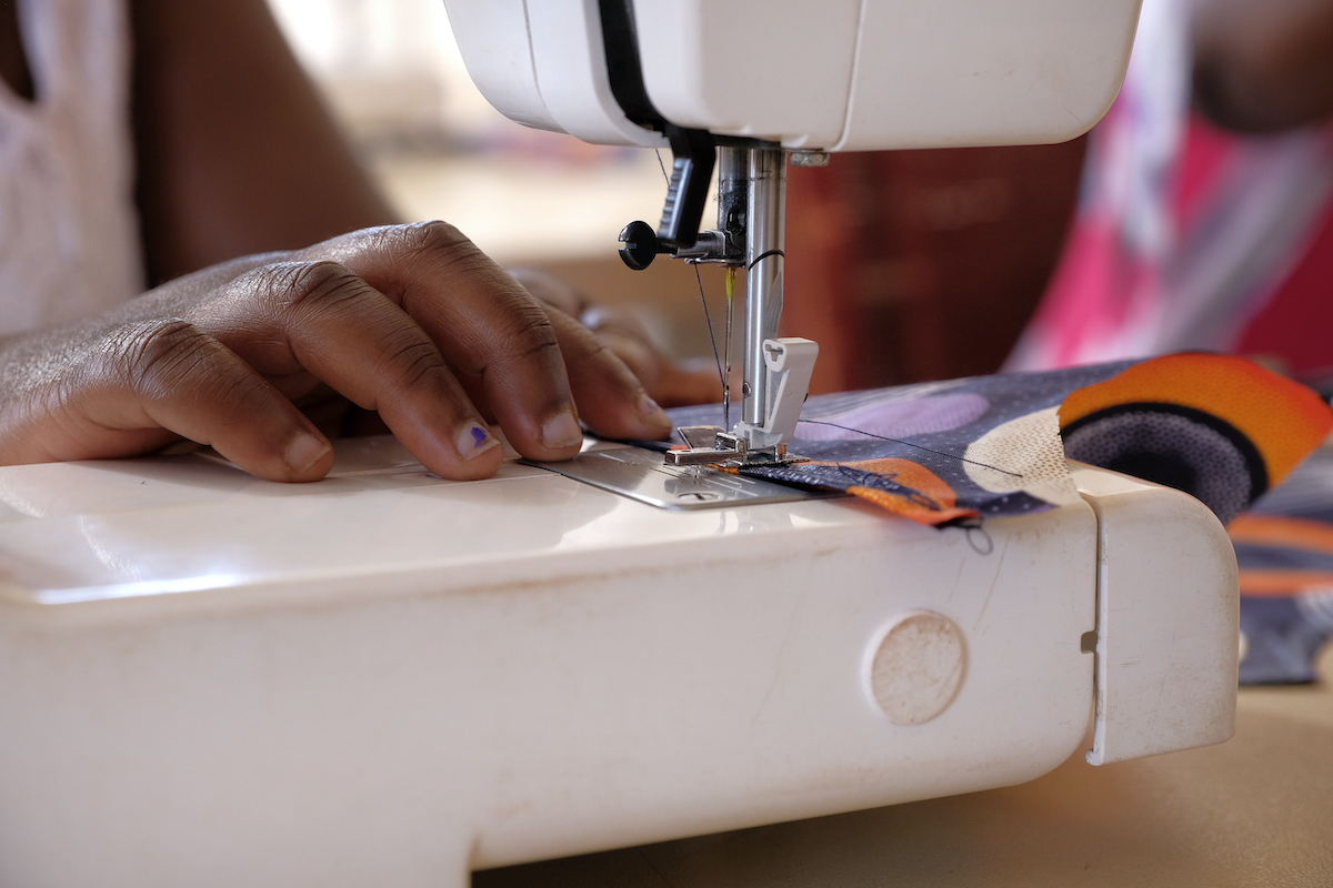 sewing machine in action at the winnie mabaso foundation project