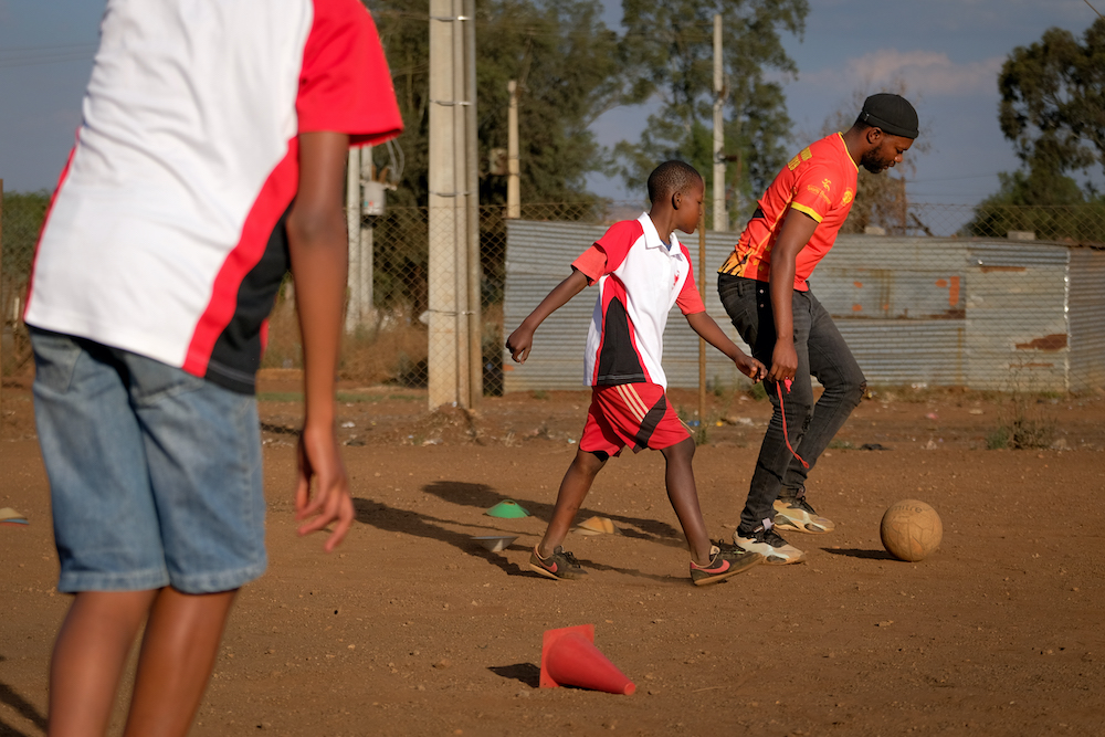 children playing football at the winnie mabaso foundation